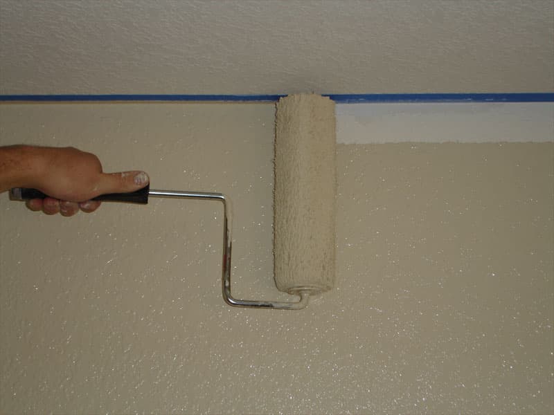 Rolling paint on an interior wall