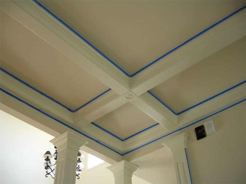 Room prepared with drop cloths and painter’s tape